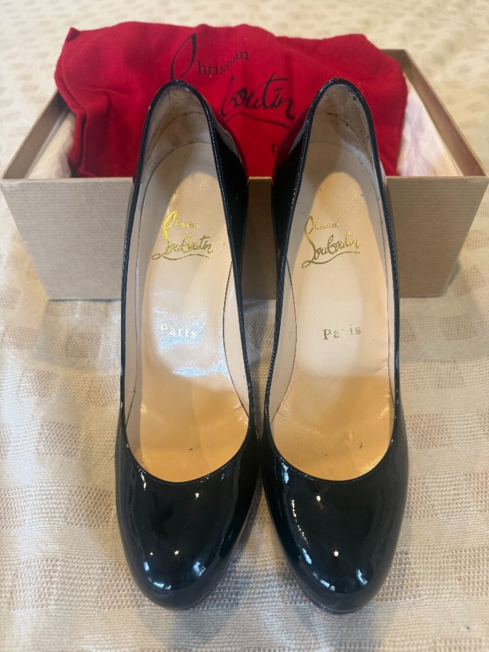 Christian Louboutin black patent pumps